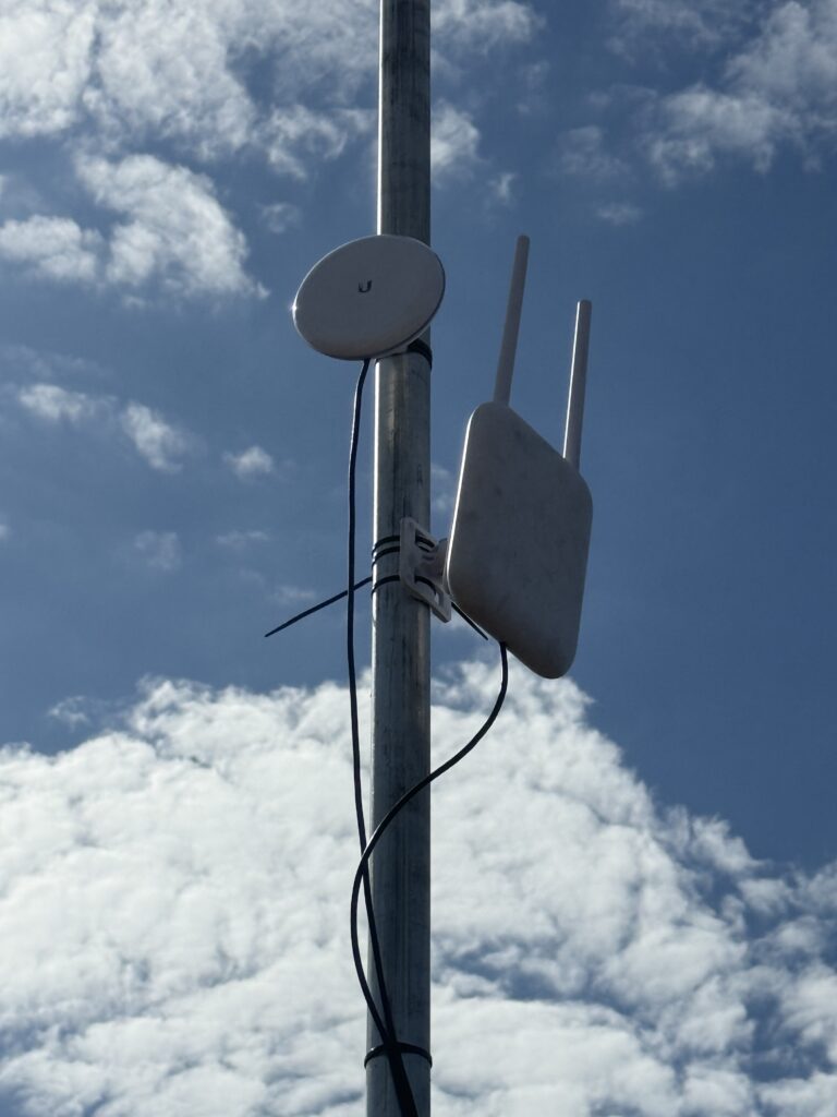 U7 Outdoor Pro, high up a pole mounted to capture the connections